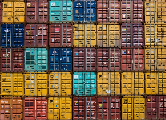 Shared groupage shipping container being loaded with export-packed household goods for part load removals to Australia